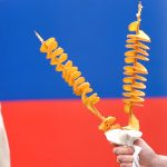 A visitor at the Thorpdale Potato Festival enjoying a twisted potato