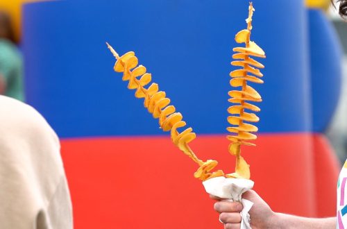 A visitor at the Thorpdale Potato Festival enjoying a twisted potato