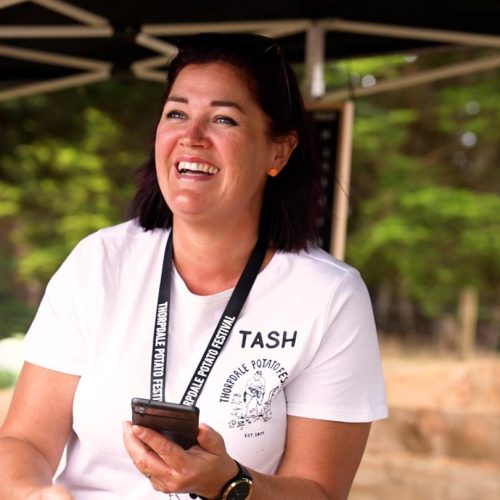 Volunteer selling merchandise at the Thorpdale Potato Festival